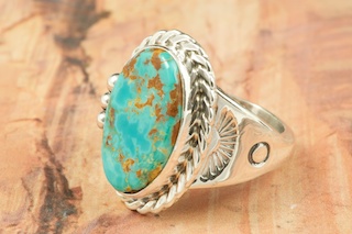 Genuine Manassa Turquoise set in Sterling Silver Ring. This Turquoise is also referred to as King�s Manassa Turquoise. The Manassa Turquoise mine is located in Manassa, Conejos County, Colorado. Created by Navajo Artist Tony Garcia. Signed by the artist.